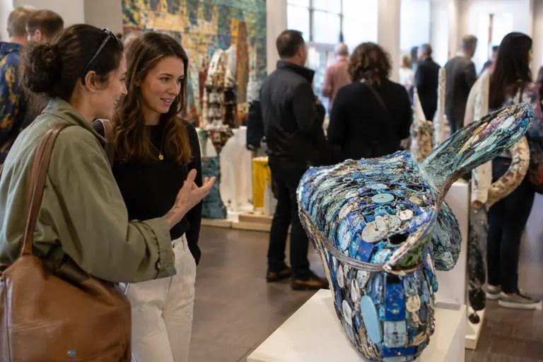 One-of-a-kind upcycled chair and garment displayed in a white gallery space